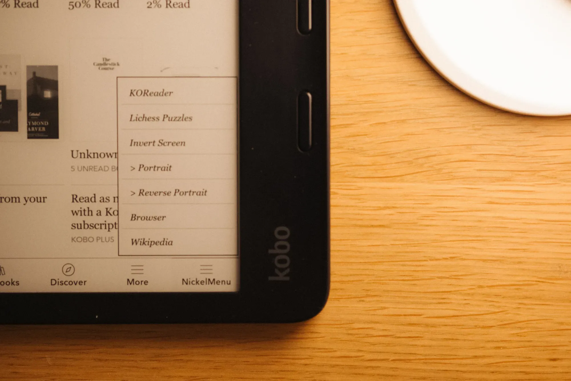 The Kobo NickelMenu open, with KOReader and Lichess Puzzles listed
